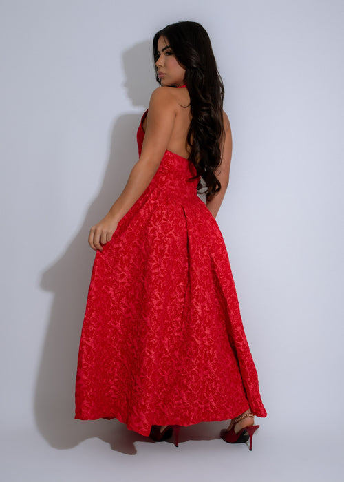 Elegant red dress featuring a floral print with a midi length