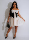 Elegant white mini dress with black lace details and flared sleeves