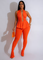 High-waisted orange leggings and matching crop top set for women