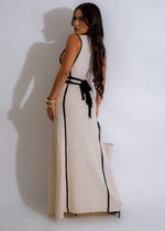 Alt text: The Knotted Back Knit Maxi Dress in a beautiful nude color with a figure-flattering silhouette, perfect for everyday wear or special occasions