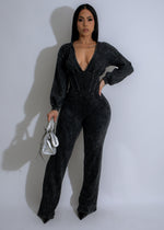 Full-length black jumpsuit with a fitted waist and wide-leg silhouette