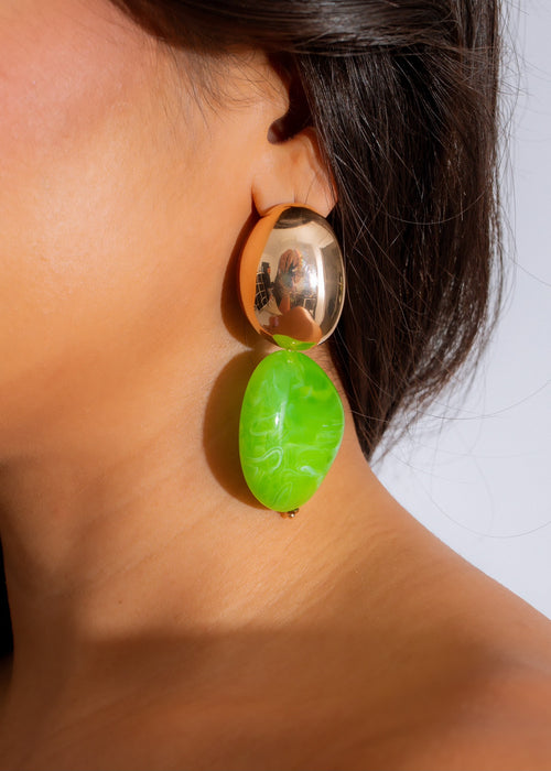 Handcrafted green swirl earrings with intricate design and delicate details