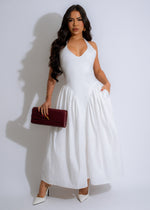 Stunning white midi dress with flowing skirt, perfect for summer days 