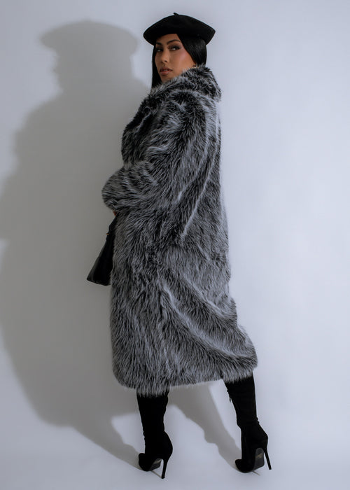  Elegant woman wearing the Storm Chic Faux Fur Coat in black