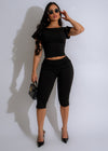 Eclipse Elegance Capris Set Black: High-waisted black capri leggings with matching sports bra and mesh details