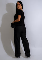 Black knit long top with a flattering silhouette and golden hour hues