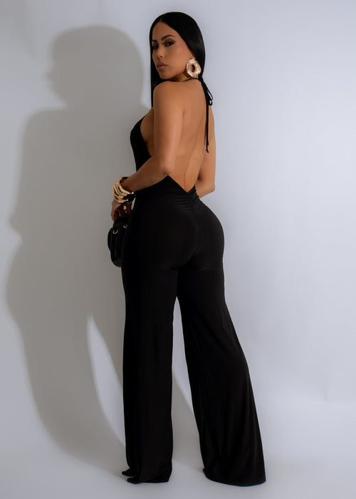 The Nebula Dreamscape Jumpsuit Black, a fashion-forward and comfortable jumpsuit for women, showcases a stunning black jumpsuit with a captivating nebula-inspired design, ideal for making a statement at any event