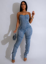 Stylish light denim jumpsuit with a relaxed fit and adjustable straps for a comfortable and trendy look