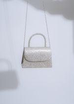  Elegant silver handbag with intricate rhinestone embellishments and sleek design