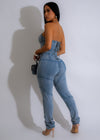  Fashionable light denim jumpsuit featuring a flattering V-neck and convenient side pockets for a chic and versatile outfit