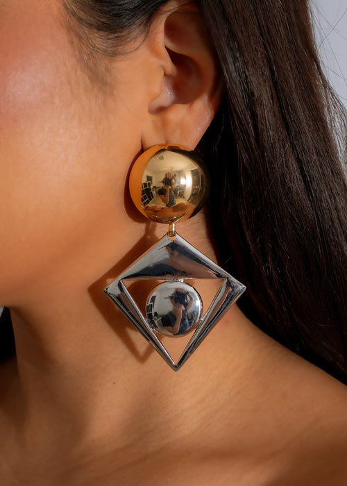 Shiny gold and silver Orbit Statement Earrings, a bold and stylish accessory