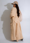 Long, elegant nude knit duster coat with a shadowy, fall-inspired design