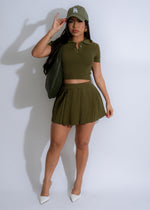 Two-piece green knit skirt set with pleated detailing for a stylish look