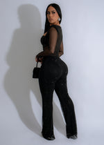  Stunning black jumpsuit featuring intricate rhinestone-embellished mesh fabric