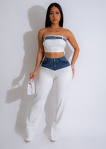 Two-piece white pant set with contrasting black details and stylish design