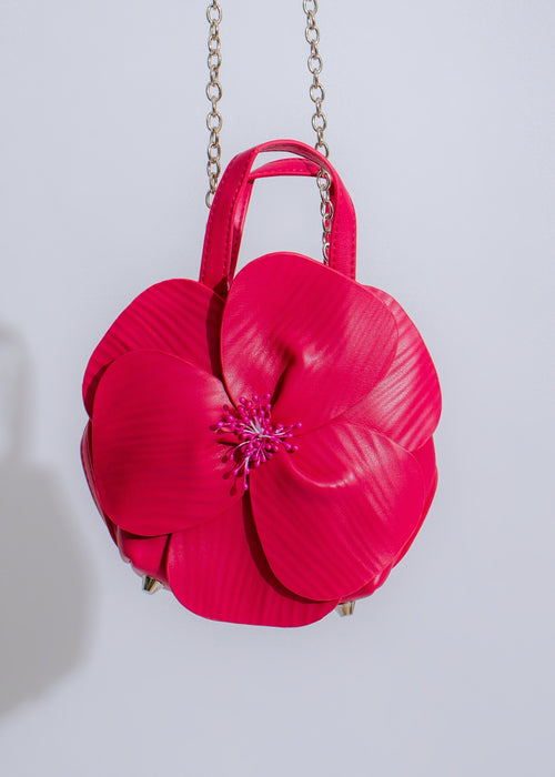 Beautiful pink handbag featuring intricate petal-inspired design