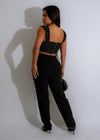 Black Polka Dot Charm Crop Top featuring a sweetheart neckline and ruffle trim hem