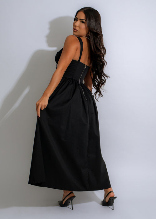  Versatile and chic black midi dress with eye-catching design, perfect for any occasion or event