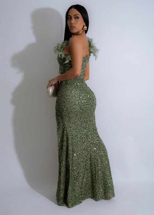  Full-length image of the Midnight Plume Sequin Maxi Dress in green, featuring a flattering empire waist and sparkling sequin embellishments