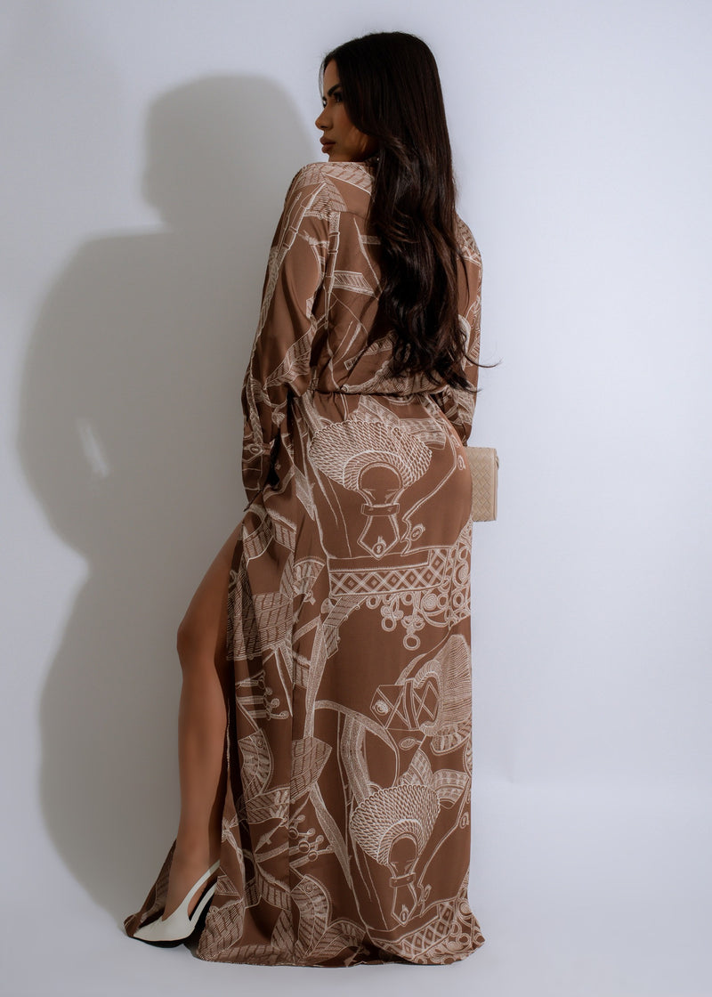  Elegant and versatile Nomad Dream Satin Maxi Dress in Brown, featuring a flattering empire waist and adjustable spaghetti straps