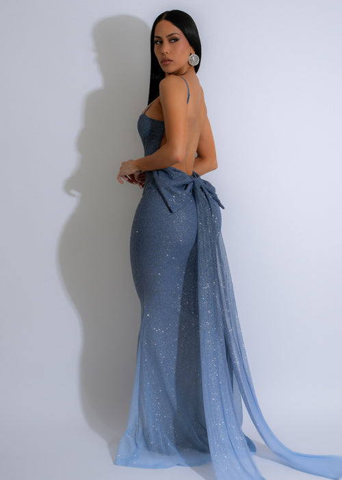 Gorgeous and glamorous Starlight Cascade Sparkly Maxi Dress in a mesmerizing blue hue, featuring a cascade of sparkles that shimmer and shine, making it a show-stopping outfit for any formal affair