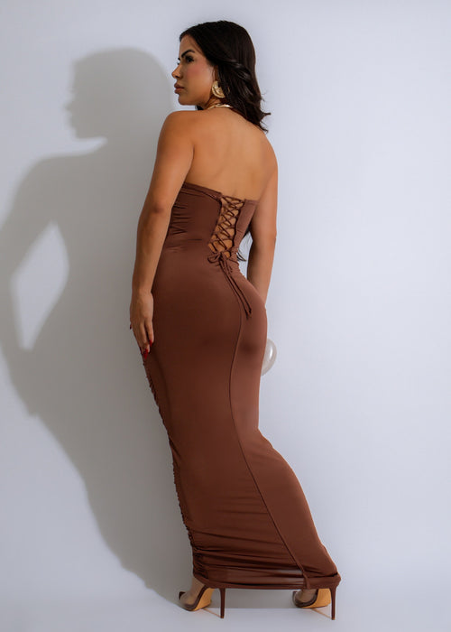  Woman wearing stylish brown Sea Breeze Ruched Maxi Dress on a beach