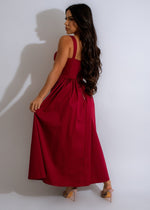 Alt text: Stunning red midi dress with unique abstract pattern and flattering silhouette