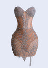 Close-up of Crystal Veil Enchantment Rhinestones Mesh Mini Dress in Nude color, sparkling in the light, featuring intricate rhinestone detailing and sheer mesh fabric