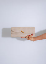 The Woven Grace Clutch White, a stylish and elegant accessory for any occasion, featuring intricate weaving and a sleek white design, perfect for adding a touch of sophistication to your ensemble 