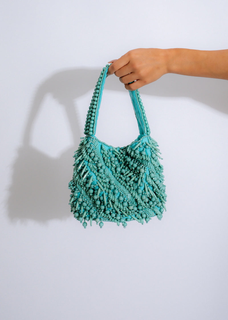 Handcrafted blue beaded elegance bag with intricate floral patterns and silver detailing