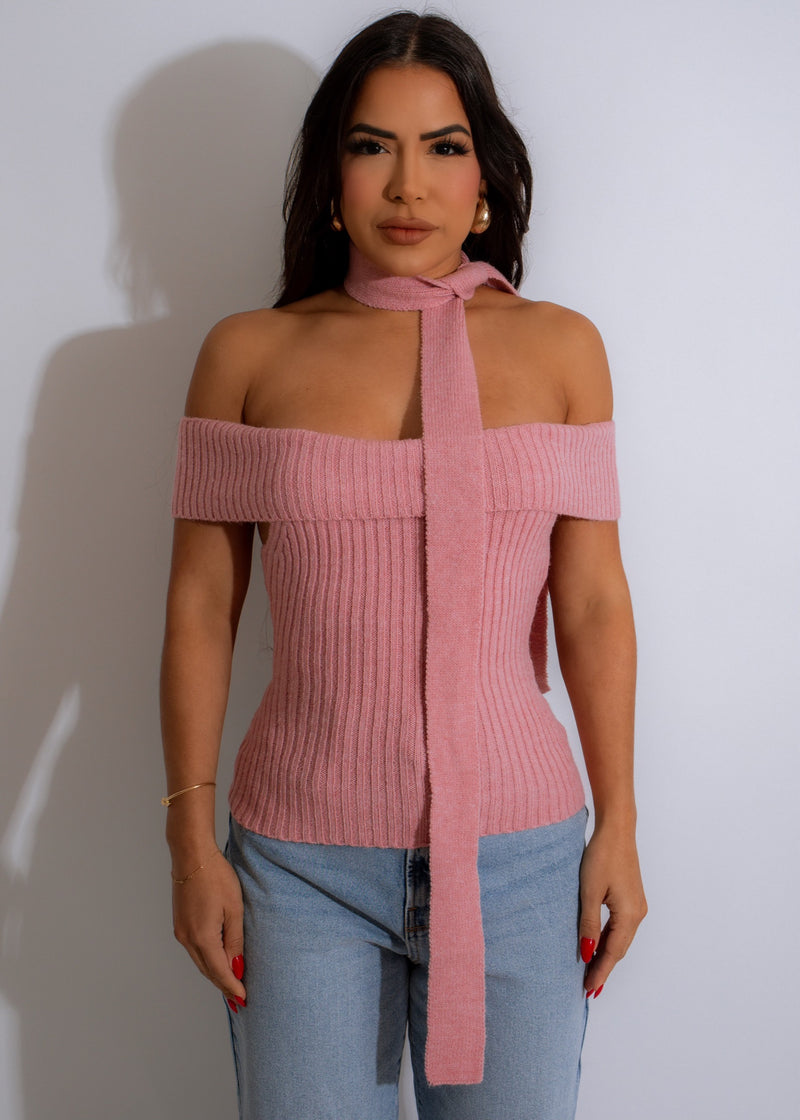 A woman wearing a soft and comfortable pink knit top