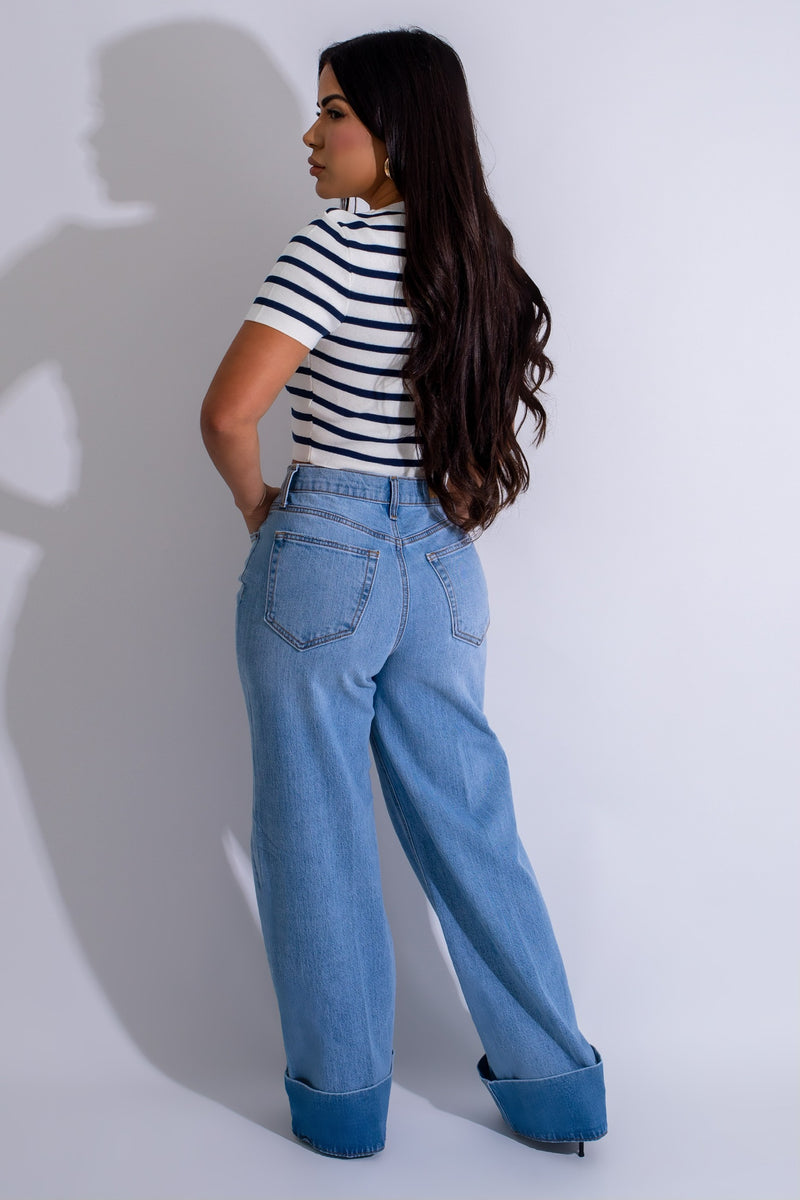  Vintage Indigo Jean Light Denim* styled with white sneakers and a graphic tee