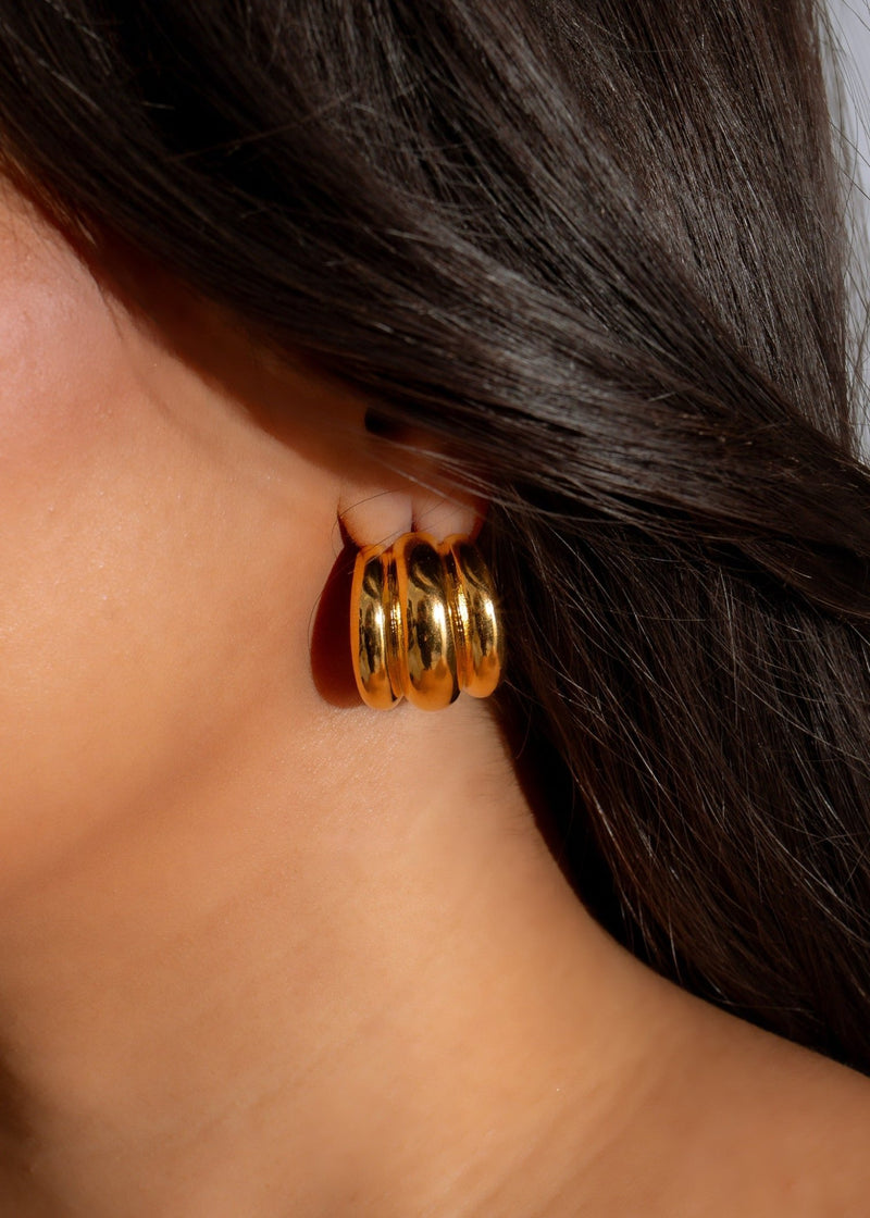 Shiny gold Waves Hoops Earrings, a fashionable accessory perfect for any outfit