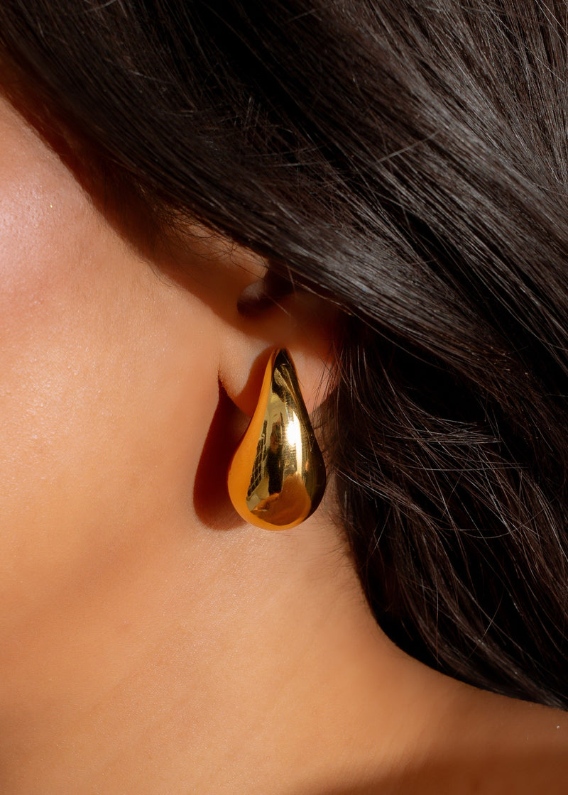 Shimmering gold Crescent Luxe Earrings, a stunning accessory for any occasion