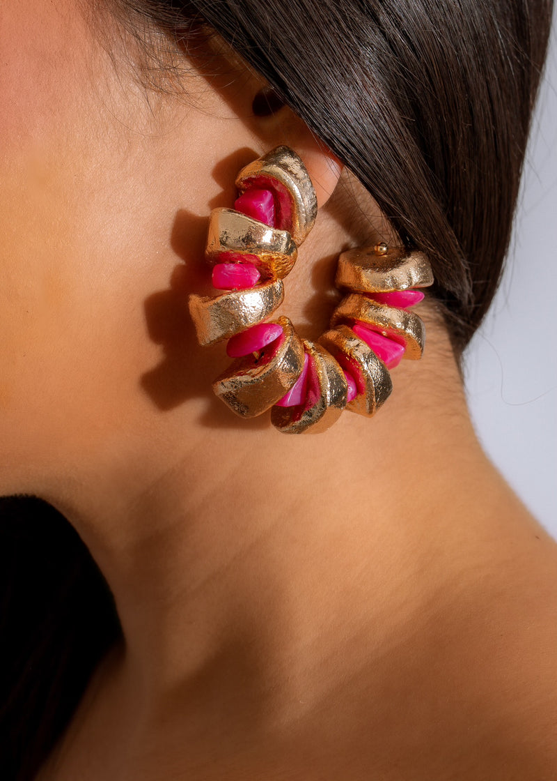 Stunning pink Check Mate Earrings, featuring intricate geometric design and delicate details