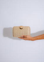 Elegant seashell weave clutch in shimmering gold with delicate design