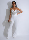 Shimmering white jumpsuit adorned with celestial-inspired rhinestones for elegant occasions