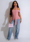 A soft and warm pink knit top with a comfortable and cozy fit