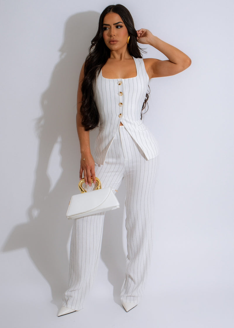 Stylish white pant set with colorful stripes, perfect for traveling or everyday wear