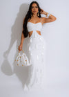 Goddess Mentality Fringe Maxi Dress White flowing in the breeze on a sunny beach 