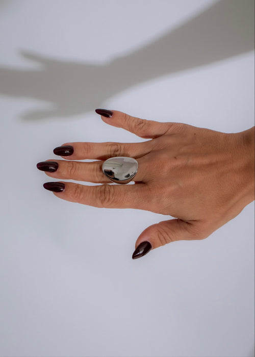 Shimmering silver Elemental Aura Ring with intricate details and mystical appeal