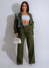 Close-up of the stylish green denim pant set from Remember Me brand with front pockets and belt loops