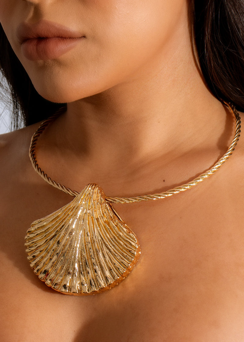 Beautiful gold Tides Shell Necklace featuring intricate shell design and chain