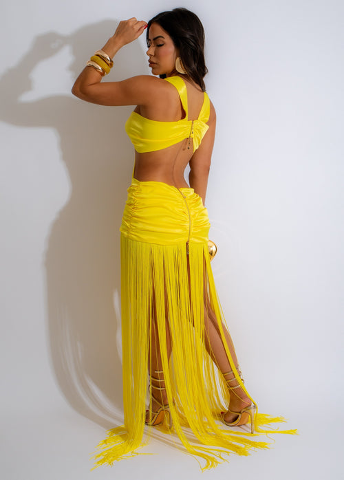 Beautiful yellow maxi dress with fringe detailing, ruched waist, and V-neckline