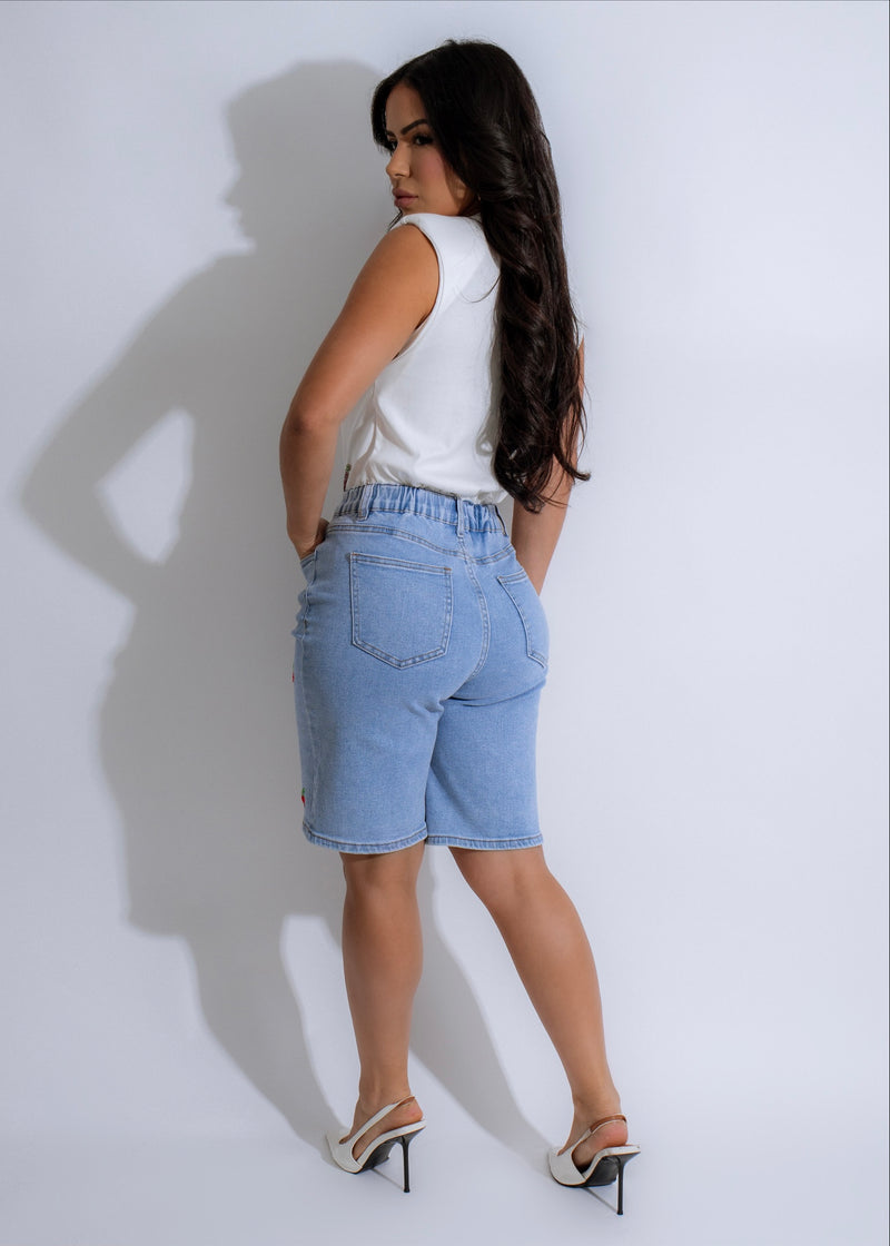  Side angle of Cherry Pop Short Light Denim featuring Button Closure and Belt Loops