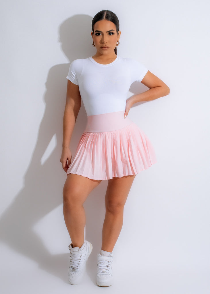 Namaste pink tennis skirt with pleated design and built-in shorts