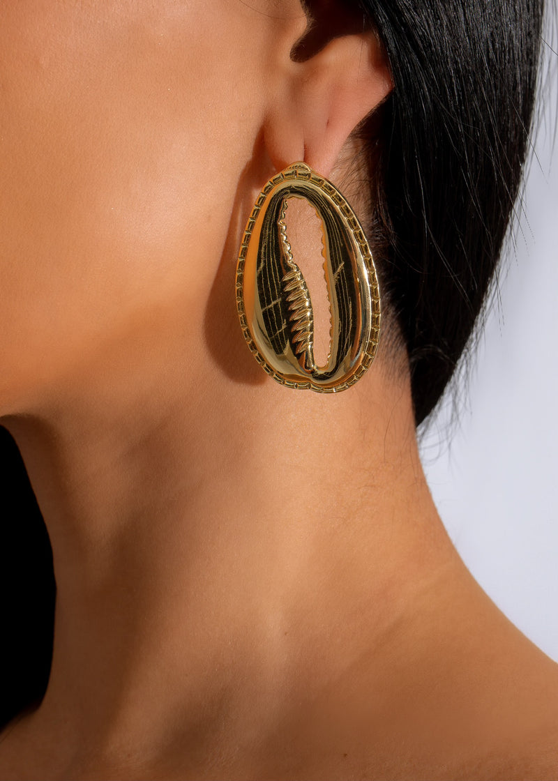 Shimmering gold Coastal Luxe Earring, a stunning addition to any outfit