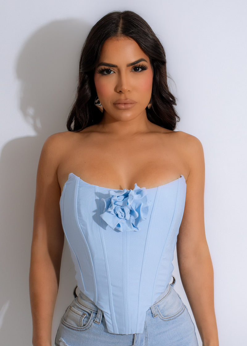  Close-up of the high-quality fabric and intricate stitching of the personal growth corset in stunning blue