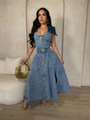 Stylish and comfortable midi dress in light denim, featuring a flattering v-neckline and adjustable spaghetti straps for a customizable fit