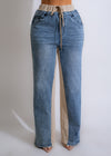 High-waisted nude denim pants with a straight-leg fit and distressed detailing